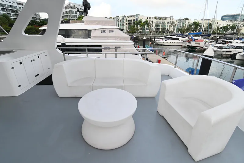  Yacht Photos Pics Luxurious 2014 Accelera 82 yacht deck with white seating and marina view.