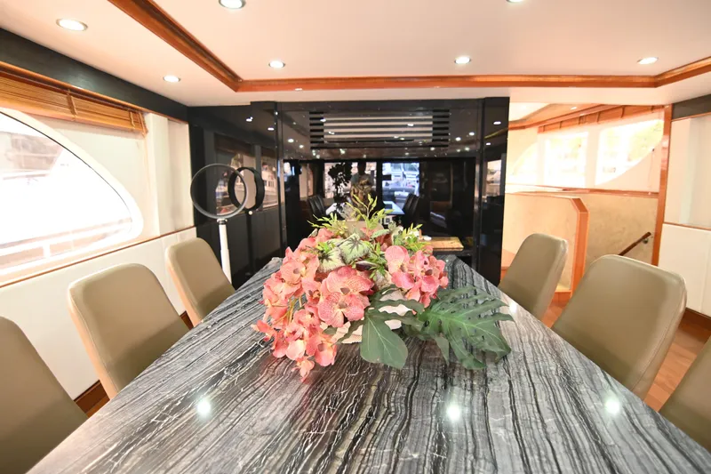  Yacht Photos Pics Luxurious dining area on 2014 Accelera 82 yacht with elegant floral centerpiece.