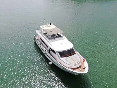  Yacht Photos Pics Luxurious 2014 Accelera 82 yacht cruising on calm green waters.
