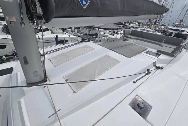 Free To Be Yacht Photos Pics 2022 Fountaine Pajot Elba 45 Catamaran deck with seating and sail details.