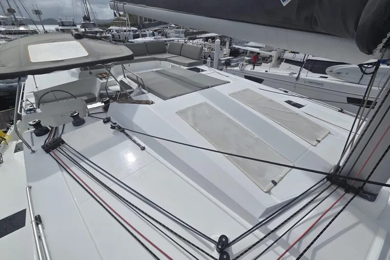 Free To Be Yacht Photos Pics 2022 Fountaine Pajot Elba 45 Catamaran deck with seating and rigging in marina.