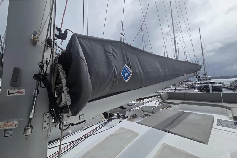 Free To Be Yacht Photos Pics 2022 Fountaine Pajot Elba 45 Catamaran with covered boom, docked in marina.