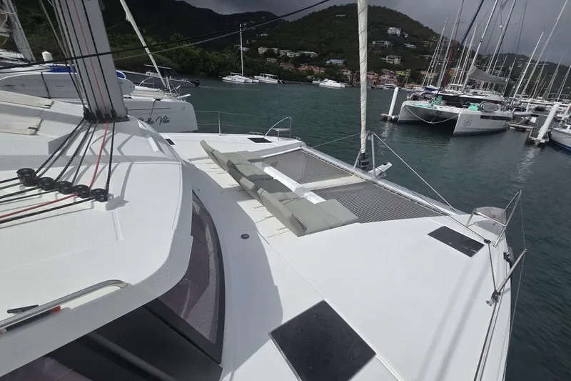 Free To Be Yacht Photos Pics 2022 Fountaine Pajot Elba 45 Catamaran docked in a scenic marina.
