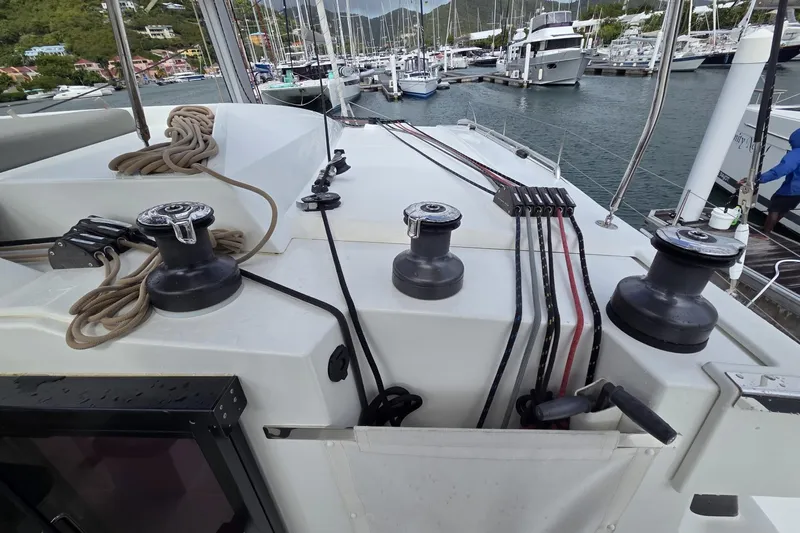 Free To Be Yacht Photos Pics 2022 Fountaine Pajot Elba 45 Catamaran deck with winches and ropes in marina.