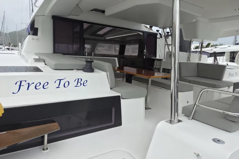 Free To Be Yacht Photos Pics 2022 Fountaine Pajot Elba 45 Catamaran, "Free To Be," with spacious outdoor seating area.