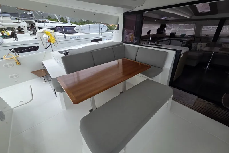 Free To Be Yacht Photos Pics 2022 Fountaine Pajot Elba 45 Catamaran with elegant outdoor seating and dining area.