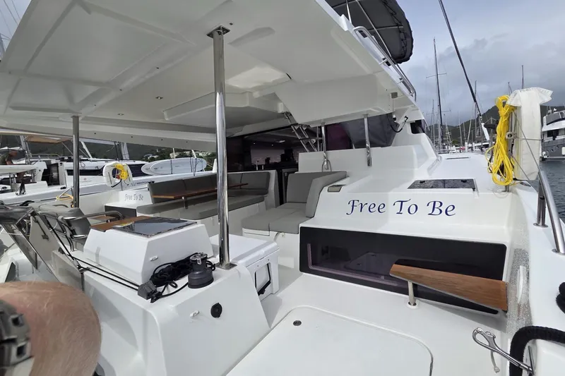 Free To Be Yacht Photos Pics 2022 Fountaine Pajot Elba 45 Catamaran, "Free To Be," docked in a marina.