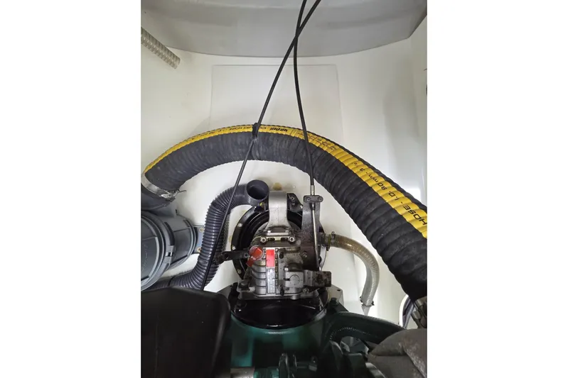 Free To Be Yacht Photos Pics Engine compartment of 2022 Fountaine Pajot Elba 45 Catamaran with visible hoses and components.