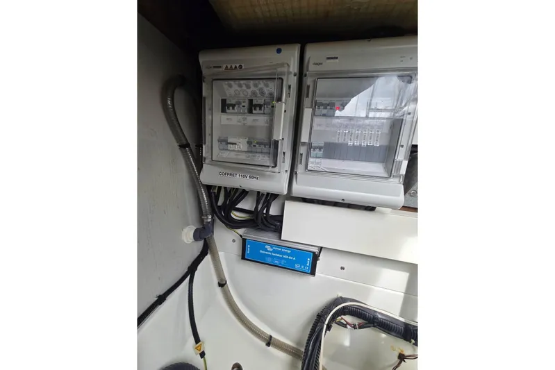Free To Be Yacht Photos Pics Electrical panel inside 2022 Fountaine Pajot Elba 45 Catamaran, featuring circuit breakers and wiring.
