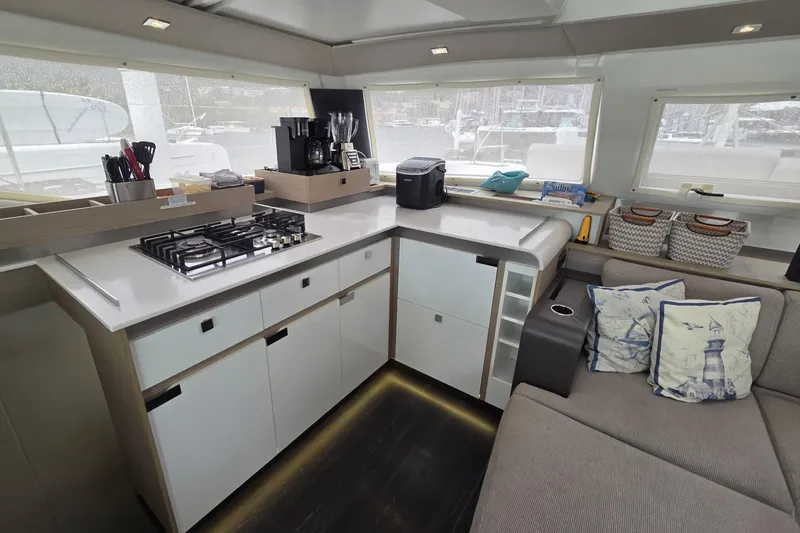 Free To Be Yacht Photos Pics Modern kitchen interior of 2022 Fountaine Pajot Elba 45 Catamaran with sleek design and appliances.