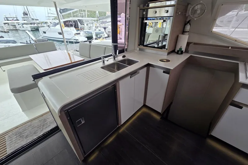 Free To Be Yacht Photos Pics Modern kitchen interior of 2022 Fountaine Pajot Elba 45 Catamaran with sleek design.