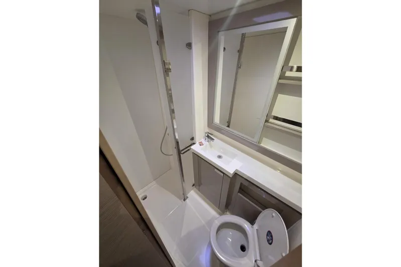Free To Be Yacht Photos Pics Modern bathroom in 2022 Fountaine Pajot Elba 45 Catamaran, featuring shower and sink.