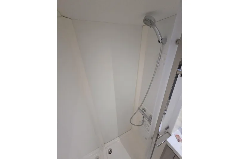 Free To Be Yacht Photos Pics Shower area in 2022 Fountaine Pajot Elba 45 Catamaran, featuring modern fixtures.