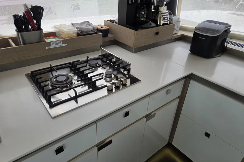 Free To Be Yacht Photos Pics Modern kitchen in 2022 Fountaine Pajot Elba 45 Catamaran with stove and appliances.