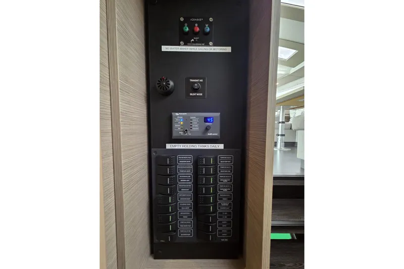 Free To Be Yacht Photos Pics Control panel of 2022 Fountaine Pajot Elba 45 Catamaran, featuring various switches and indicators.