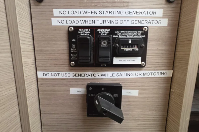 Free To Be Yacht Photos Pics Control panel of 2022 Fountaine Pajot Elba 45 Catamaran with generator usage instructions.