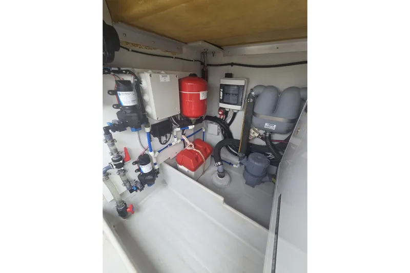 Free To Be Yacht Photos Pics Engine room of 2022 Fountaine Pajot Elba 45 Catamaran with equipment and wiring.