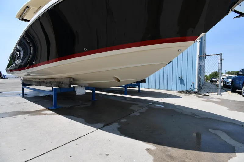  Yacht Photos Pics 2024 Chris-Craft Catalina 30 boat hull on display in a marina.