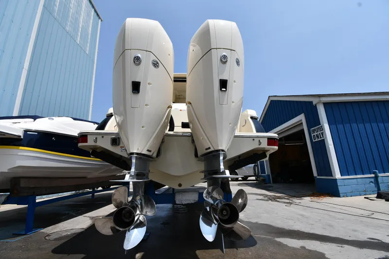  Yacht Photos Pics 2024 Chris-Craft Catalina 30 boat with dual outboard engines in a marina setting.