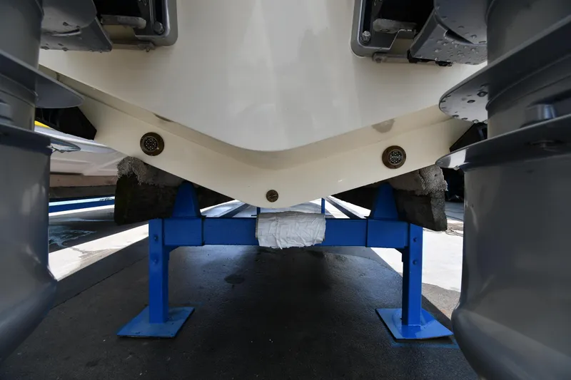  Yacht Photos Pics 2024 Chris-Craft Catalina 30 boat hull on blue support stand.