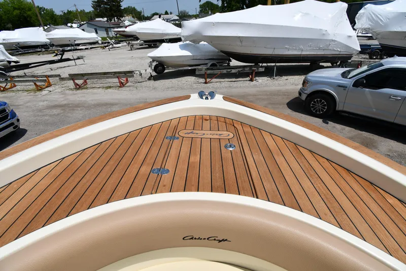  Yacht Photos Pics 2024 Chris-Craft Catalina 30 boat with teak deck in a marina.