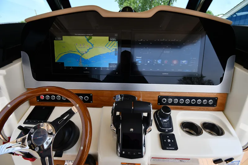  Yacht Photos Pics 2024 Chris-Craft Catalina 30 dashboard with navigation screens and controls.