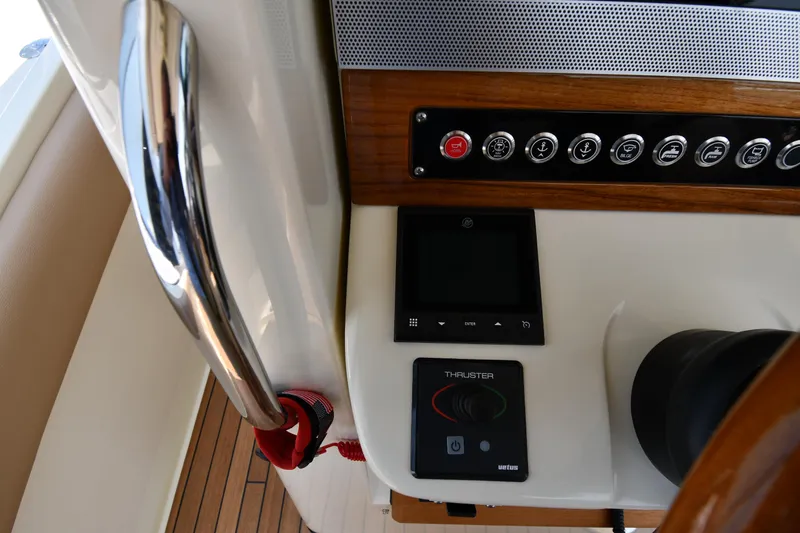  Yacht Photos Pics 2024 Chris-Craft Catalina 30 dashboard with control panel and thruster system.