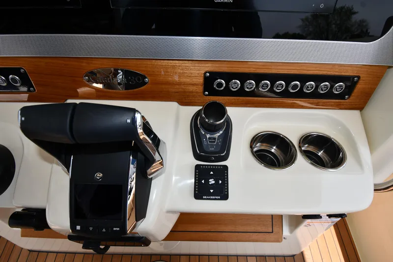  Yacht Photos Pics 2024 Chris-Craft Catalina 30 helm with controls and cup holders.