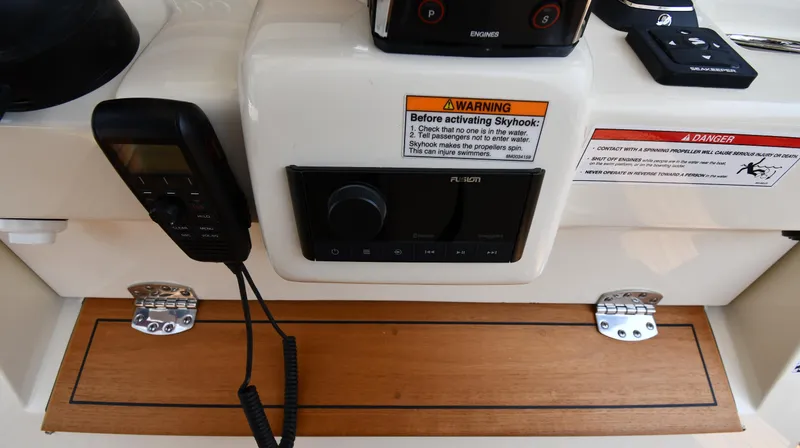  Yacht Photos Pics 2024 Chris-Craft Catalina 30 control panel with warning labels and communication device.