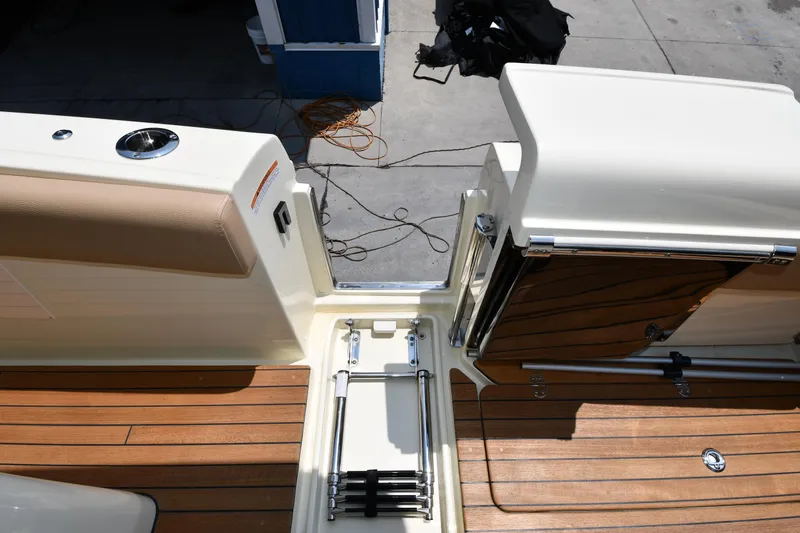  Yacht Photos Pics 2024 Chris-Craft Catalina 30 boat deck with teak flooring and retractable ladder.
