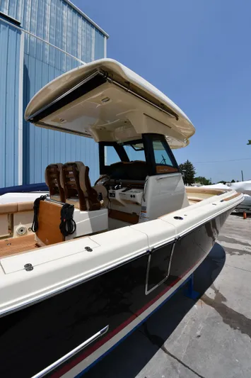  Yacht Photos Pics 2024 Chris-Craft Catalina 30 boat with sleek design and modern features, docked outdoors.
