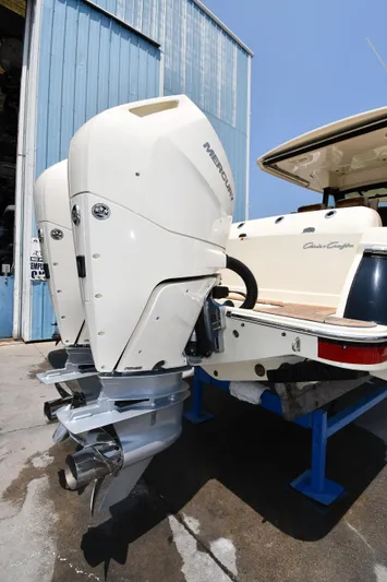  Yacht Photos Pics 2024 Chris-Craft Catalina 30 with dual Mercury outboard engines, docked at a marina.