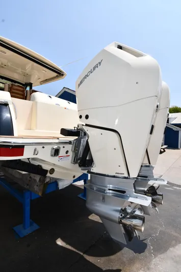  Yacht Photos Pics 2024 Chris-Craft Catalina 30 with dual Mercury outboard engines, docked on a sunny day.