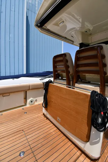 Yacht Photos Pics 2024 Chris-Craft Catalina 30 boat interior with wooden deck and seating.