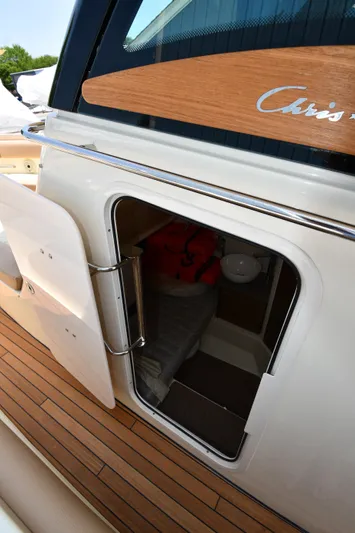  Yacht Photos Pics 2024 Chris-Craft Catalina 30 cabin entrance with teak flooring and sleek design.