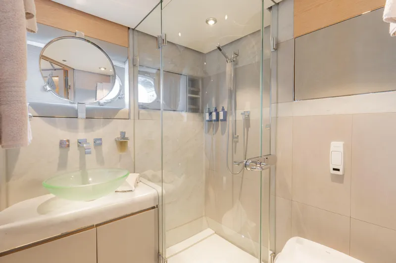 Renegade Yacht Photos Pics Luxurious yacht bathroom with glass shower, modern fixtures, and elegant design, Lloyds Ships Custom 1992.