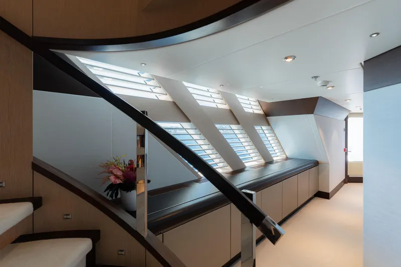 Renegade Yacht Photos Pics Luxurious interior of 1992 Lloyds Ships Custom yacht with modern design and elegant staircase.