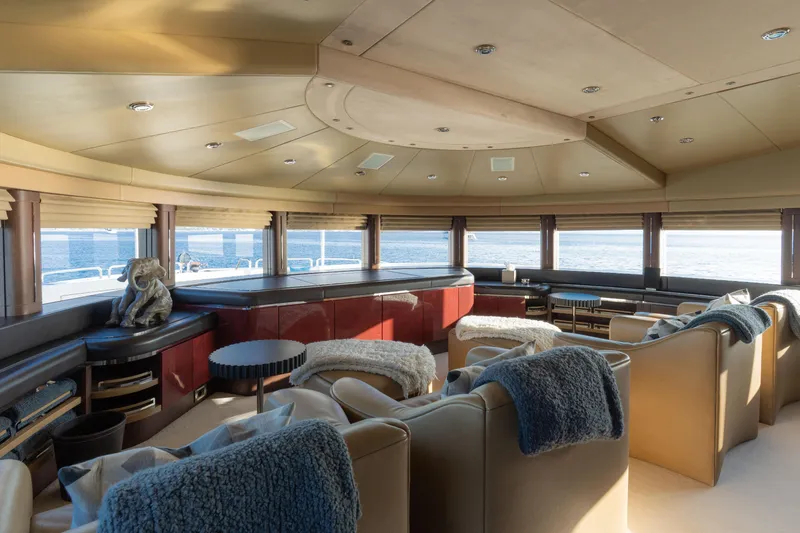 Renegade Yacht Photos Pics Luxurious yacht interior with plush seating, panoramic windows, and ocean view, Lloyds Ships Custom 1992.