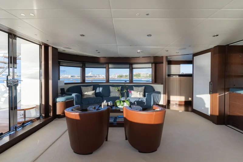 Renegade Yacht Photos Pics Luxurious yacht interior with elegant seating, panoramic windows, and modern decor, Lloyds Ships Custom 1992.