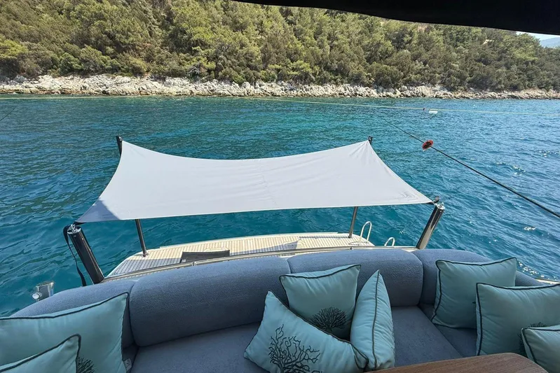  Yacht Photos Pics Luxurious 2014 Princess Flybridge 82 Motor Yacht with elegant seating and scenic ocean view.