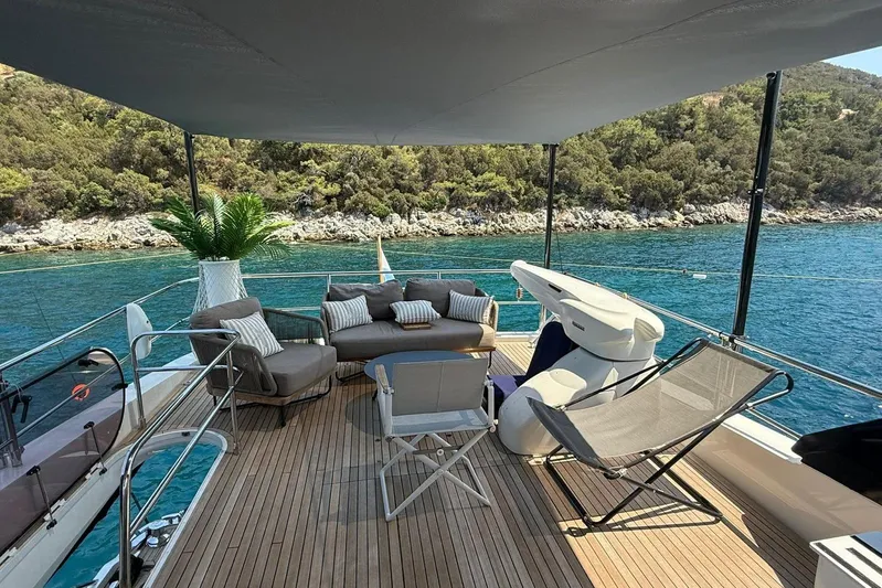  Yacht Photos Pics Luxurious 2014 Princess Flybridge 82 Motor Yacht with elegant deck seating and scenic ocean view.