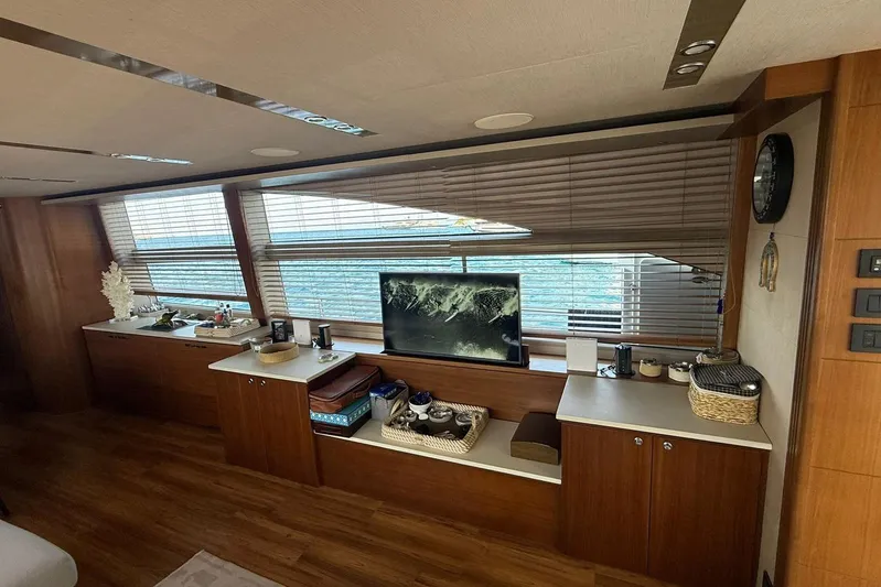  Yacht Photos Pics Luxurious interior of 2014 Princess Flybridge 82 Motor Yacht with elegant wood finishes.