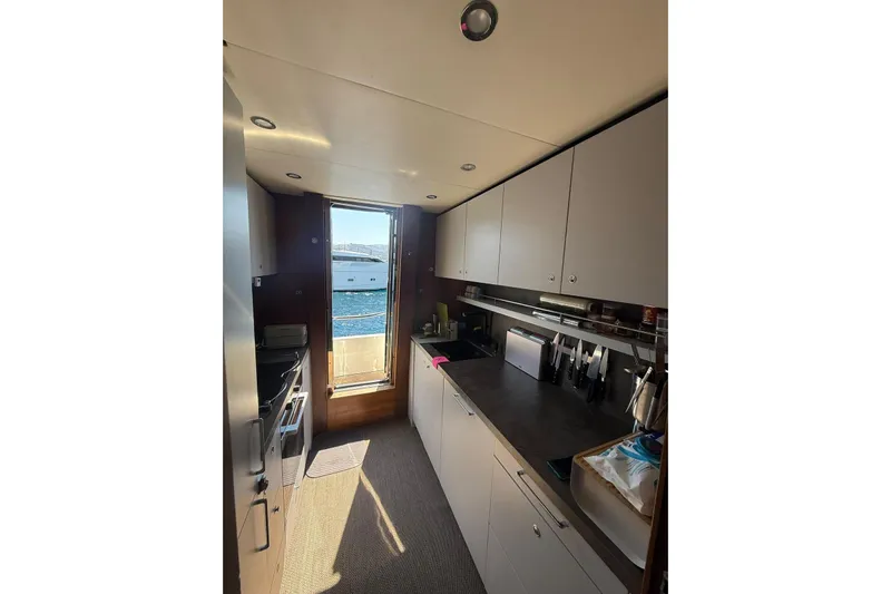  Yacht Photos Pics Modern kitchen interior on 2014 Princess Flybridge 82 Motor Yacht with ocean view.