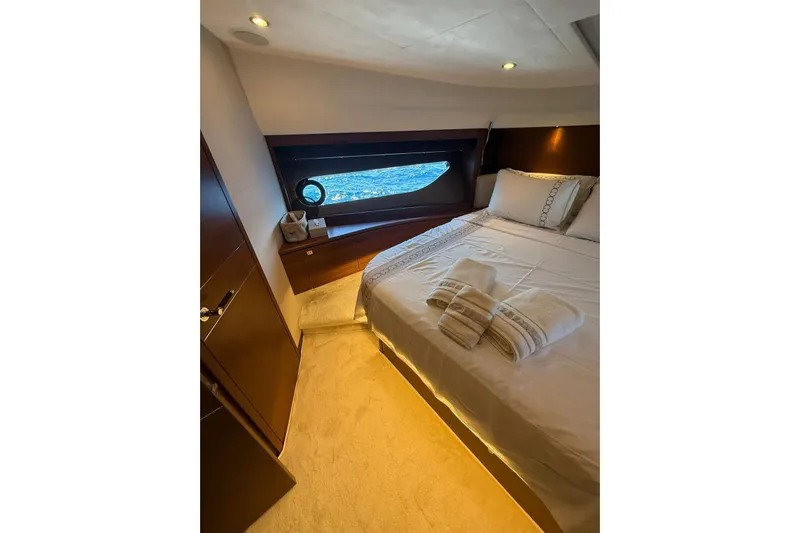  Yacht Photos Pics Luxurious bedroom interior of 2014 Princess Flybridge 82 Motor Yacht with ocean view.