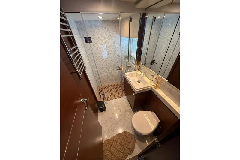  Yacht Photos Pics Luxurious bathroom in 2014 Princess Flybridge 82 Motor Yacht with modern fixtures and elegant design.