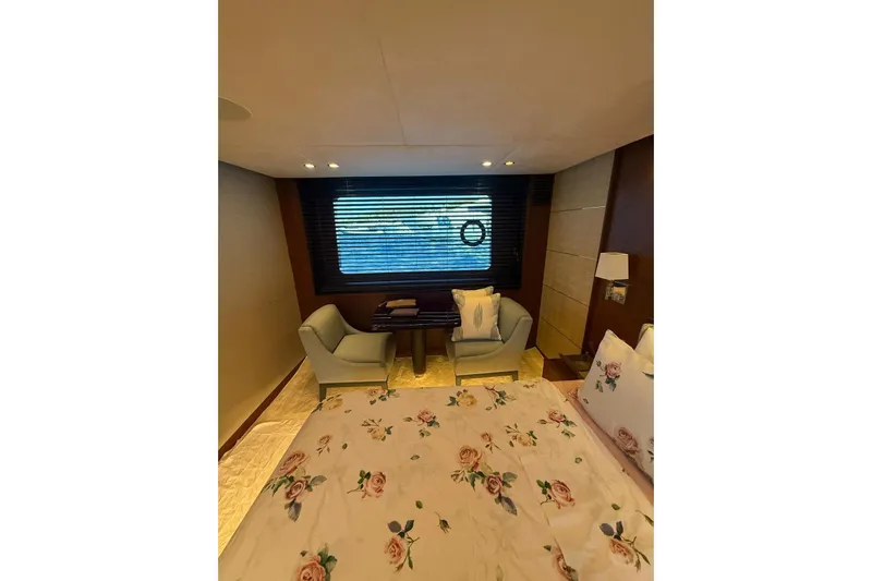  Yacht Photos Pics Luxurious cabin interior of 2014 Princess Flybridge 82 Motor Yacht with floral bedding.