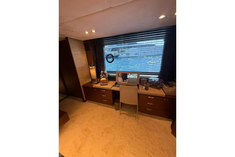  Yacht Photos Pics Luxurious interior of 2014 Princess Flybridge 82 Motor Yacht with elegant desk and window view.