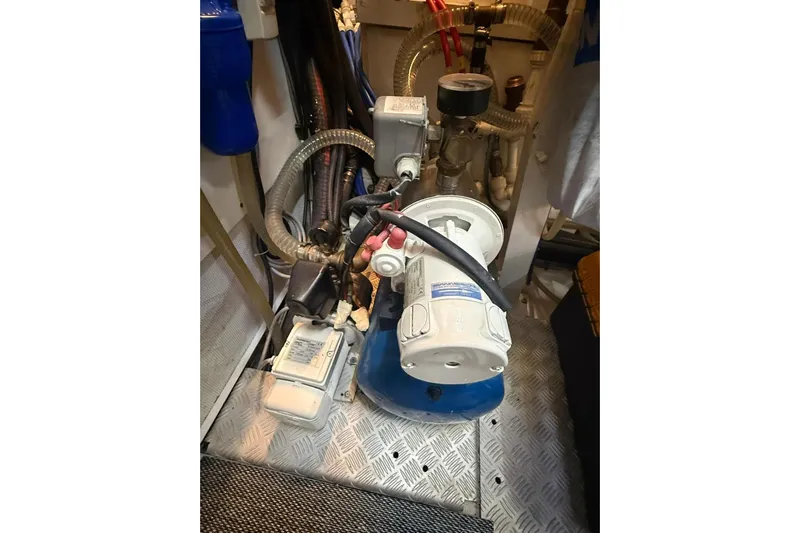  Yacht Photos Pics Engine room of 2014 Princess Flybridge 82 Motor Yacht, featuring mechanical components and piping.