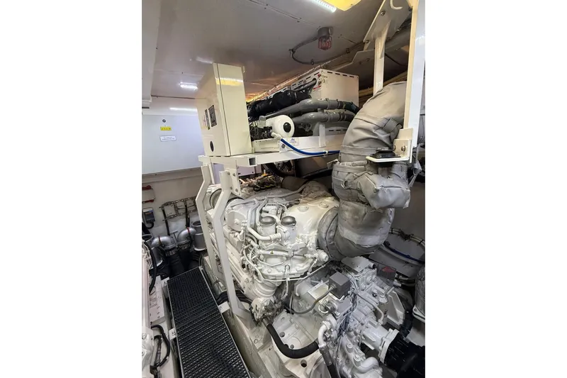  Yacht Photos Pics Engine room of 2014 Princess Flybridge 82 Motor Yacht, showcasing mechanical components and systems.