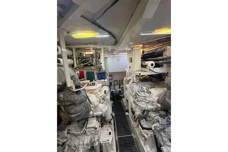  Yacht Photos Pics Engine room of 2014 Princess Flybridge 82 Motor Yacht, showcasing machinery and equipment.